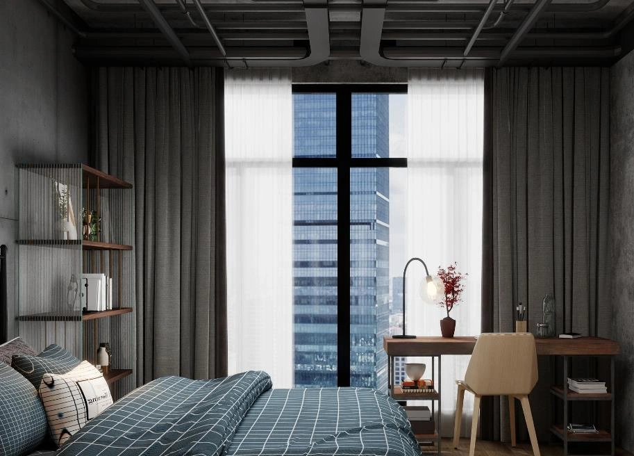 Dark gray blackout curtains create a modern and cozy atmosphere in a guy’s bedroom.