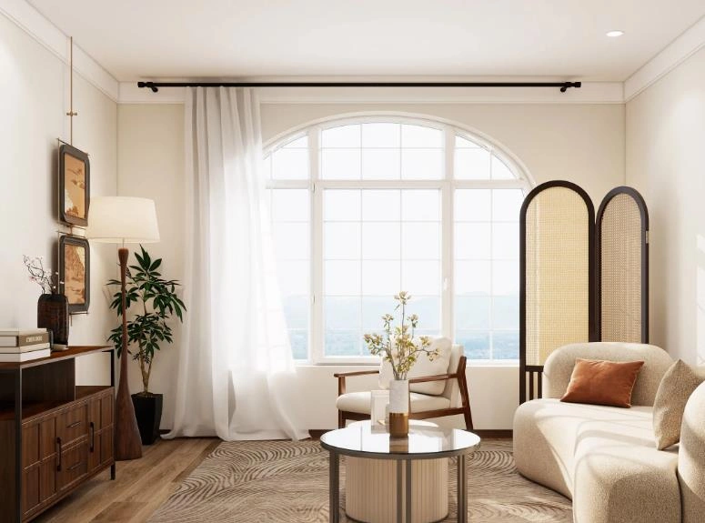 White blackout curtains on a black rod soften the ambiance of the small living room.