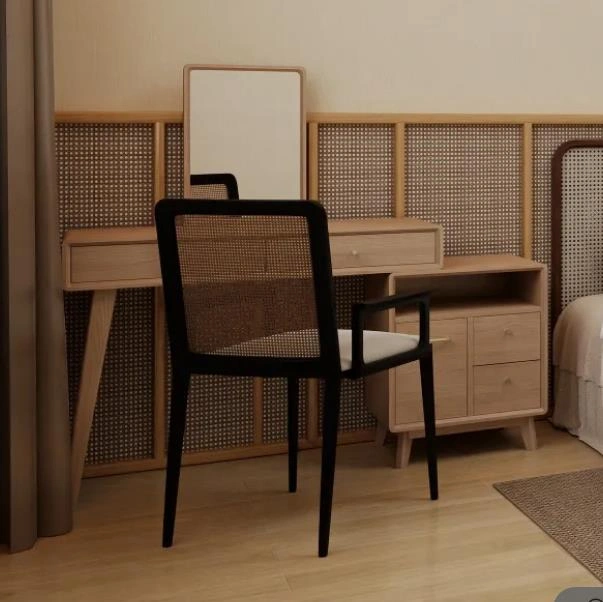 Small bedroom with a compact light-wood dressing table featuring drawers for organized storage.