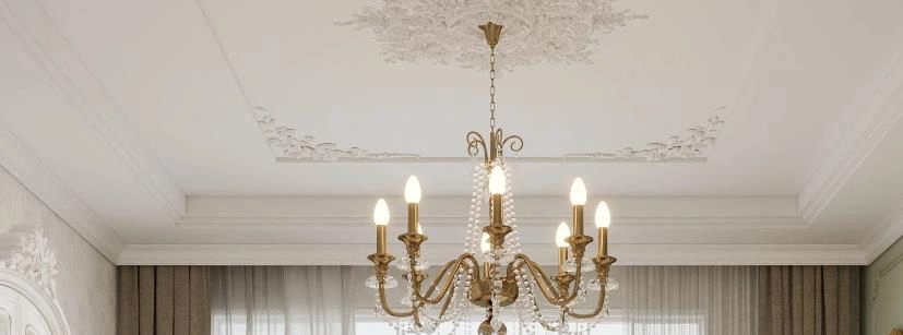 Tiny bedroom featuring a French-style embossed white ceiling with a gold crystal chandelier that adds luxury and depth.