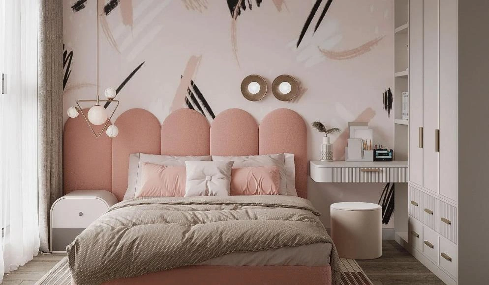 Young women&rsquo;s bedroom idea with pink graffiti wall, curved headboard, and soft pastel bedding.