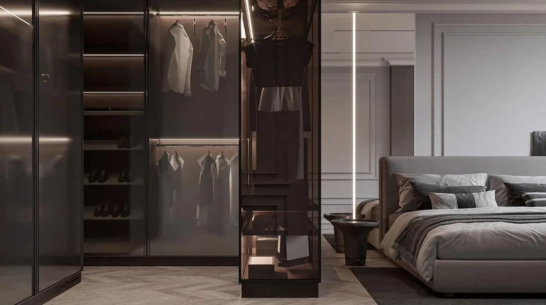Neutral-style women&rsquo;s bedroom with gray bedding, black-glass wardrobe, and minimal d&eacute;cor.