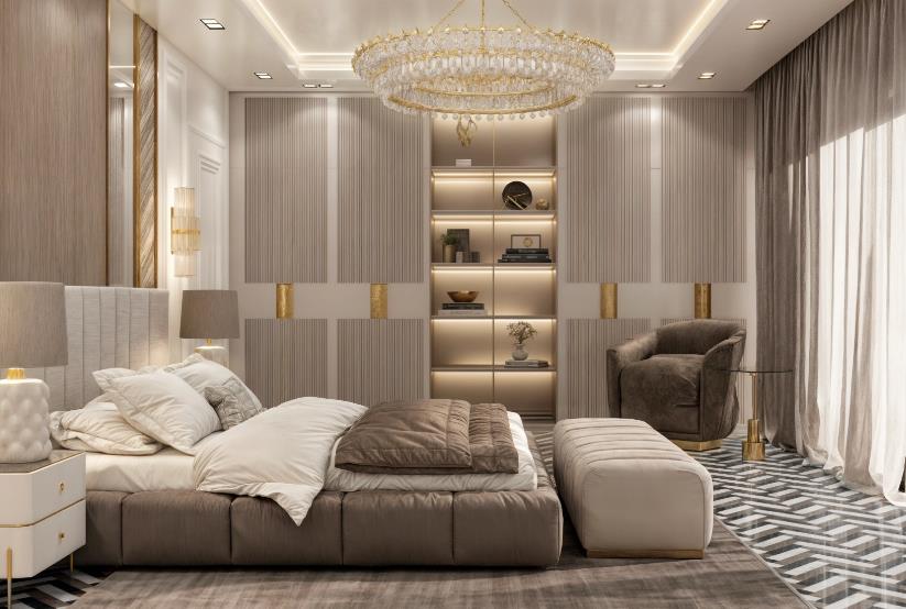Luxurious women&rsquo;s master bedroom featuring a crystal chandelier, velvet seating, and gold-accented cabinetry.