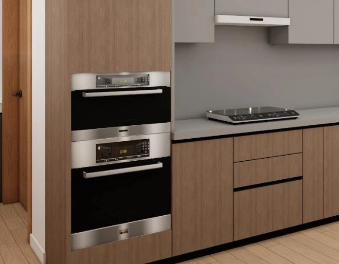 Tiny kitchen design featuring a built-in double oven with a silver frame and a compact induction cooktop.