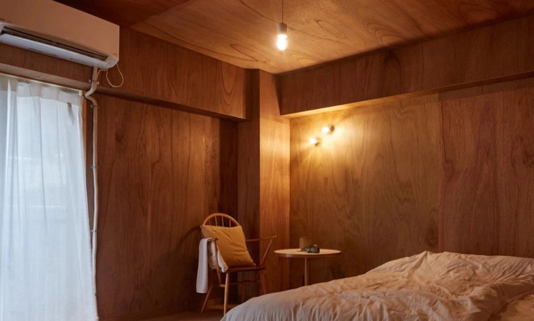 Solid wood ceiling and wall panels for cozy natural apartment.