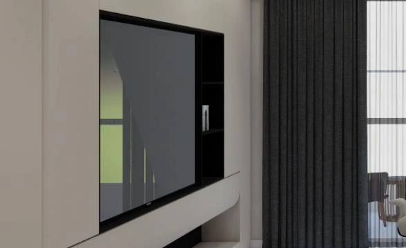 White built-in TV wall unit with black accent shelf in a small apartment.
