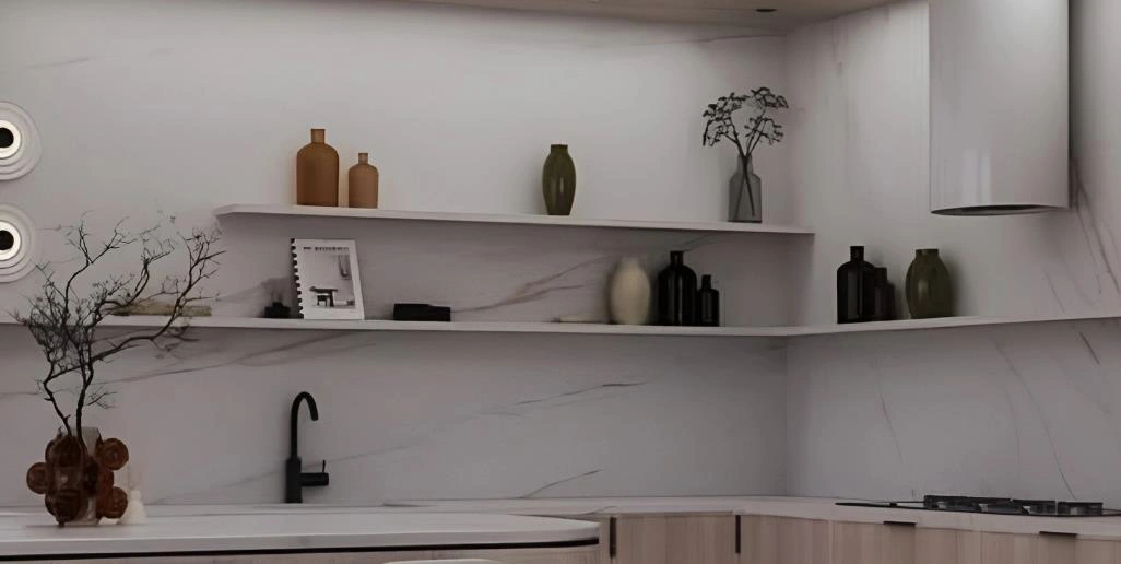 Tiny kitchen idea with white L-shaped wall-mounted shelves displaying colorful bottles and decorative items.