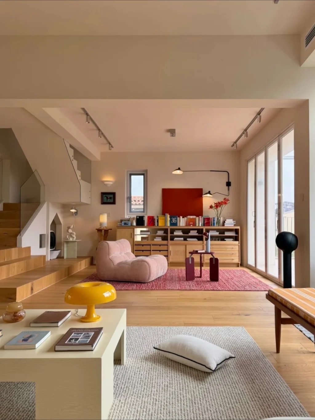 Warm Minimalism with Playful Color Accents 🎨   Seamlessly blending creamy neutrals and natural wood