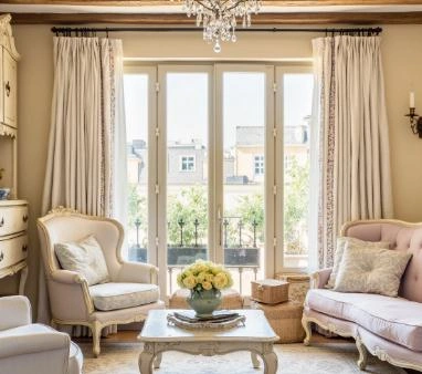 The beige pencil pleat curtains in the living room