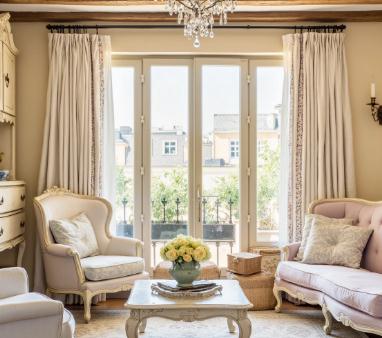 The beige pencil pleat curtains in the living room