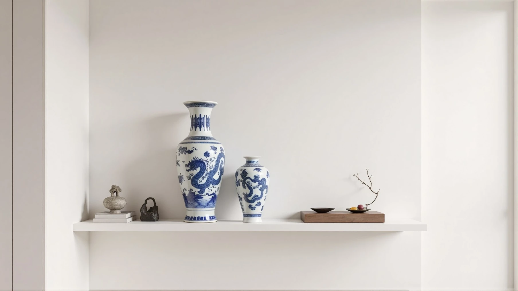 Blue and white chinoiserie porcelain set on white shelf